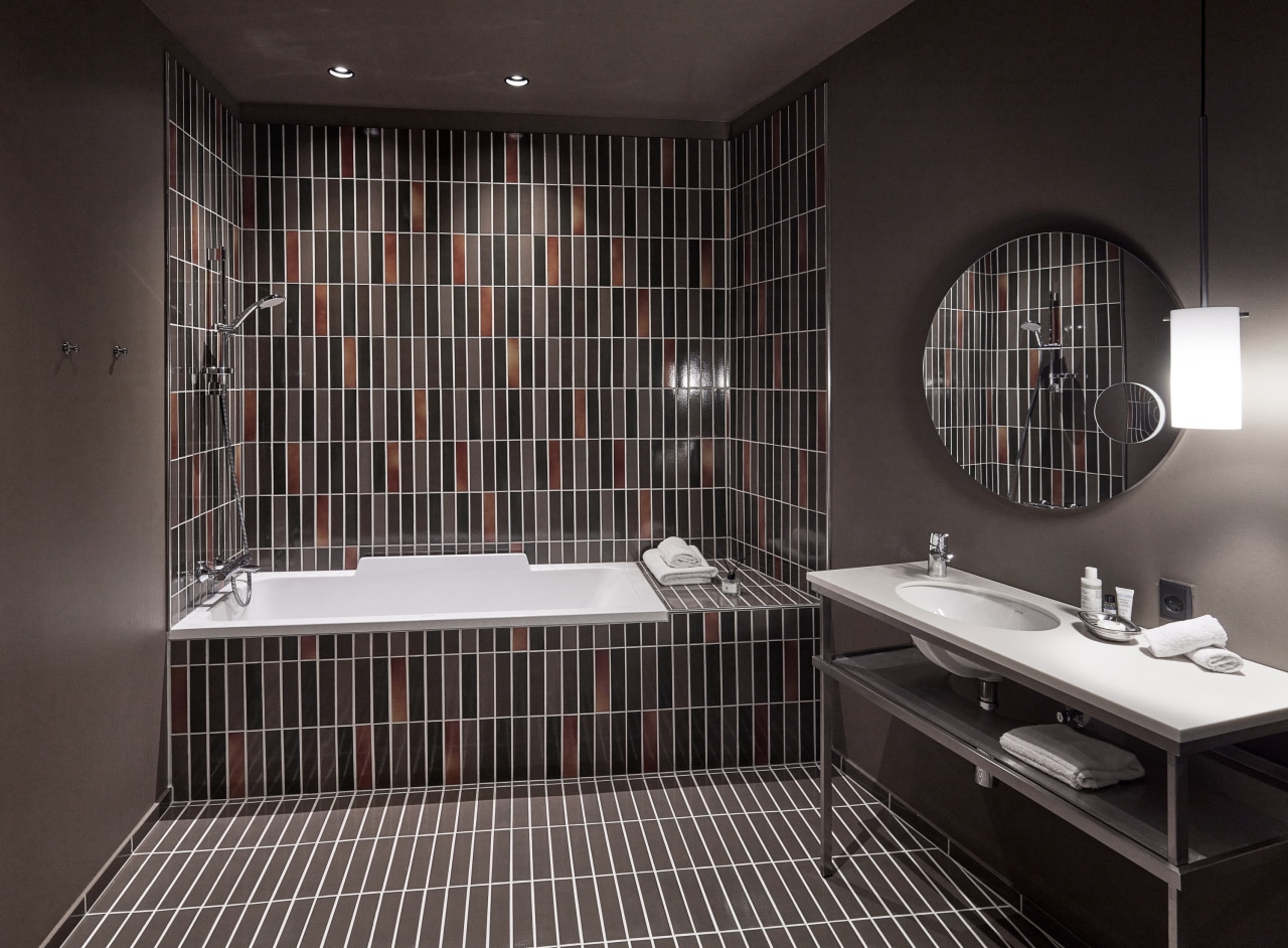 Luxury boutique hotel’s industrial-chic bathrooms could inspire a modern domestic setting